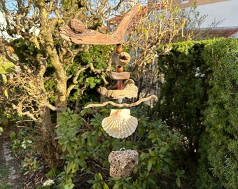 Large handmade decorative wind chime made of natural driftwood pieces and decorative beads, as a decoration for hanging in the living room and garden