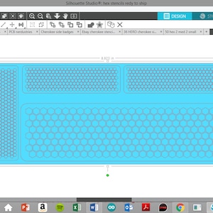 May include: A computer screen displaying a design program with a blue background and a pattern of hexagons. The design is labeled "hex stencils redy to ship".