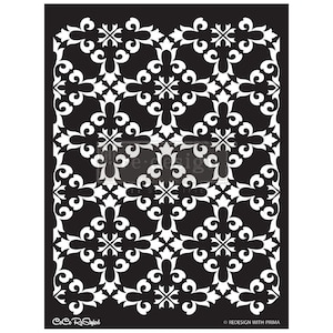 May include: A black and white stencil featuring a repeating floral pattern. The design includes stylized fleur-de-lis and scroll elements, creating a symmetrical and ornate aesthetic. The stencil is labeled "CoCo ReStyled" and "RE DESIGN WITH PRIMA".