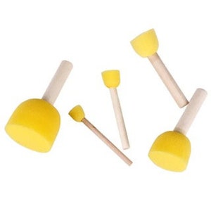 May include: Set of four yellow sponge paint brushes with wooden handles. The brushes are different sizes.