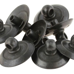 May include: A group of eight black metal buttons with a loop on top. The buttons are round and have a slightly raised edge.