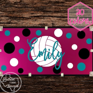 May include: A pink and white volleyball banner with a volleyball graphic and the name "Emily" in teal script. The banner has a polka dot pattern with black and teal dots.
