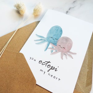 Pode incluir: Uma ilustra&ccedil;&atilde;o em aquarela de dois polvos se abra&ccedil;ando, com o texto "you octopi my heart".