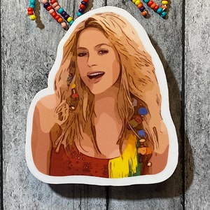 Op de afbeelding: Een gestanste sticker met een gestileerde illustratie van een vrouw met lang blond haar. Ze draagt een rode top met een gele en regenboogkleurige accent. Kleurrijke kralen zijn zichtbaar op de achtergrond.