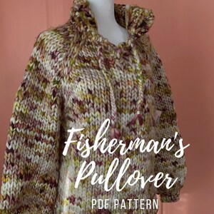 May include: A chunky knit Fisherman's Pullover in cream, yellow, and burgundy hues. The sweater features a high, hooded collar with a drawstring and a relaxed fit. The text "Fisherman's Pullover PDF Pattern" is displayed on the front.