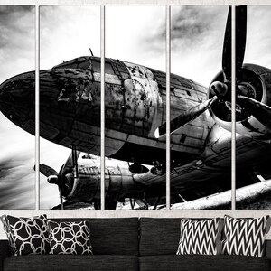 May include: Black and white photo of a vintage airplane with a propeller. The airplane is weathered and has a rustic look. The photo is split into five sections.