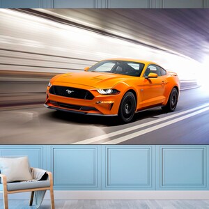 May include: A bright orange Ford Mustang sports car speeding through a tunnel with a bright light at the end.