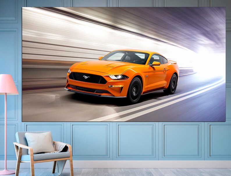 May include: A bright orange Ford Mustang sports car speeding through a tunnel with a bright light at the end.