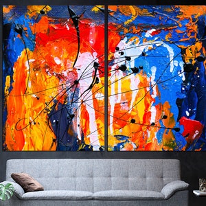 May include: Abstract art painting with a mix of bright colors, including blue, red, yellow, orange, and white. The painting is done in a bold, expressive style with thick brushstrokes and splatters of paint.