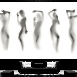 May include: Five blurry silhouettes of people in a black and white photograph. The silhouettes are in various poses and are positioned in a row against a white background.