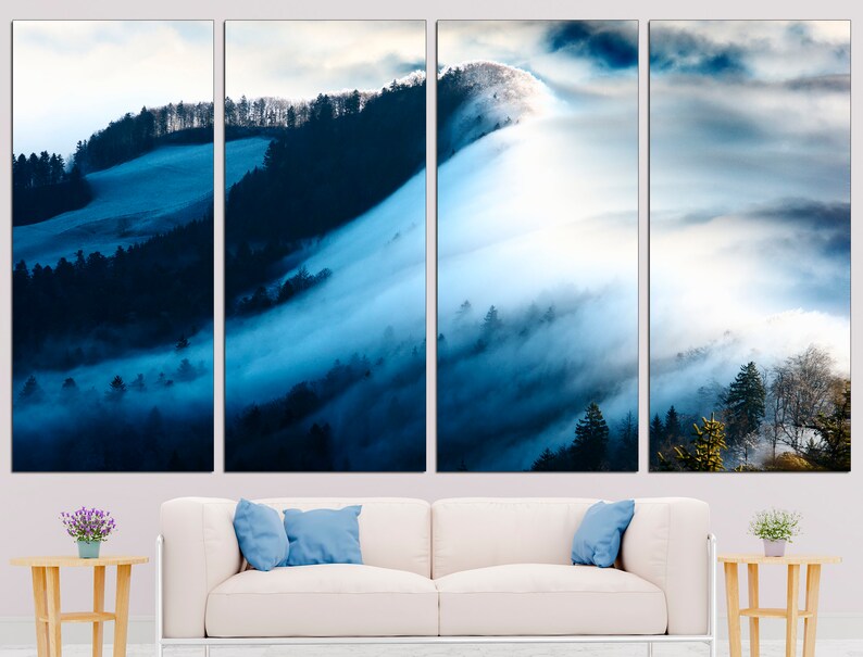 May include: A panoramic view of a misty forest with rolling hills and a blue sky. The fog is thick and white, creating a dreamy and ethereal atmosphere.