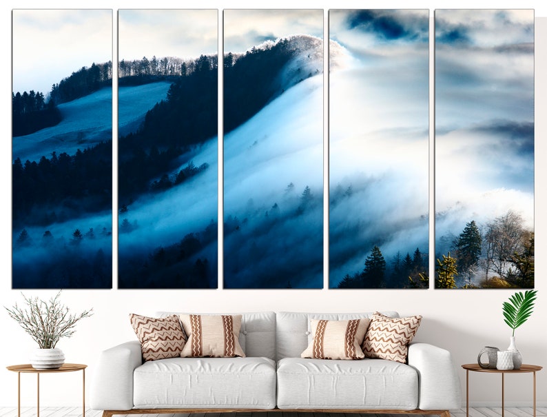 May include: A panoramic view of a misty forest with rolling hills and trees. The fog is thick and white, creating a dreamy and ethereal atmosphere. The colors are mostly blue and white, with hints of green in the trees.