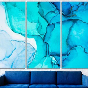 May include: Abstract art print with a blue and white color scheme. The print is divided into three panels, each featuring swirling, organic shapes.