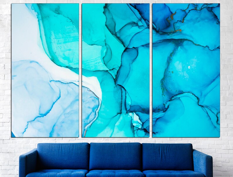 May include: Abstract art print with a blue and white color scheme. The print is divided into three panels, each featuring swirling, organic shapes.