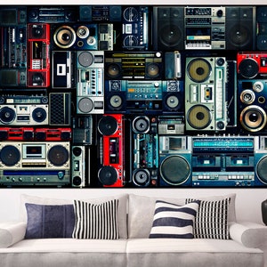 May include: A collage of vintage boomboxes and cassette players in various colors and styles, including red, blue, black, and silver. The boomboxes are arranged in a grid pattern on a black background.