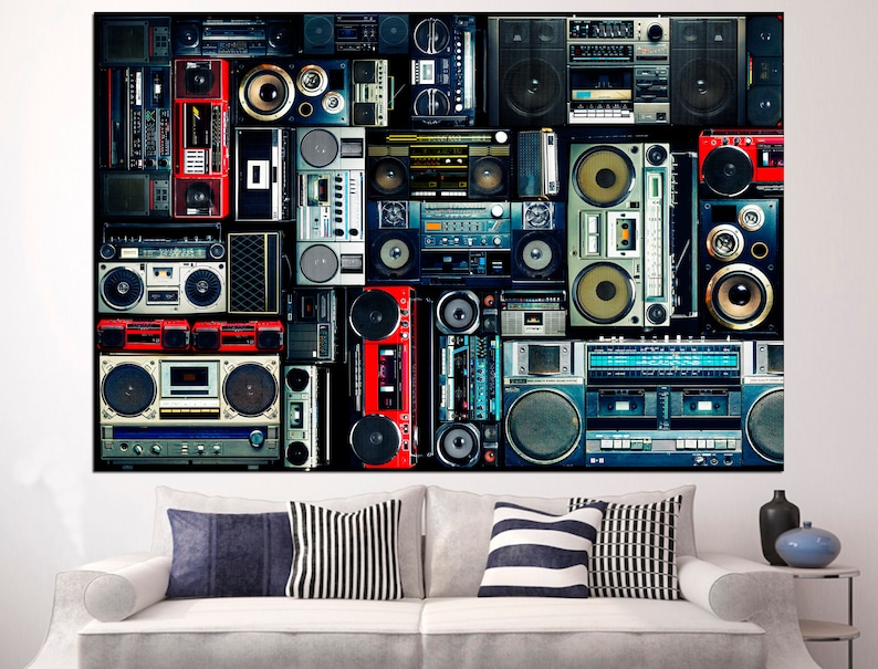 May include: A collage of vintage boomboxes and cassette players in various colors and styles, including red, blue, black, and silver. The boomboxes are arranged in a grid pattern on a black background.