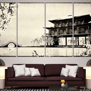 May include: A black and white canvas print of a traditional Japanese house with a bridge and cherry blossoms. The house is on stilts over a body of water. The print is divided into four panels.