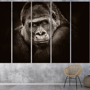 May include: A black and white close-up photograph of a gorilla's face. The gorilla is looking directly at the camera with a serious expression. The image is split into five sections.
