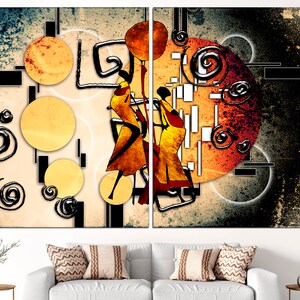 May include: Abstract art print featuring two stylised figures dancing against a background of swirling shapes and circles in shades of orange, yellow, and black.