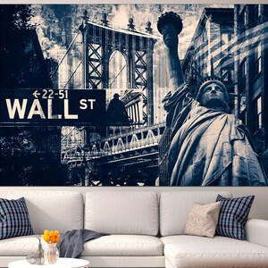 May include: A canvas print featuring a collage of New York City landmarks in shades of blue and white. The Statue of Liberty and the Manhattan Bridge are prominent, with a Wall Street sign in the foreground. The overall theme is urban and architectural.