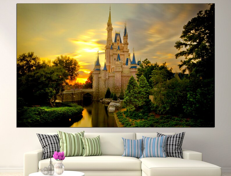 May include: A fairytale castle with tall towers and spires, surrounded by lush green trees and a reflecting pond. The castle is illuminated by a warm golden sunset.