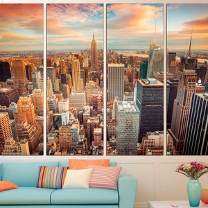 May include: A panoramic view of the New York City skyline at sunset, featuring the Empire State Building and other skyscrapers. The city is bathed in warm, golden light, with clouds casting long shadows across the buildings.