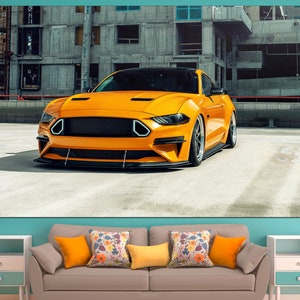 May include: A bright yellow sports car parked in an urban setting. The car has a black grille and black wheels. The car is parked in front of a concrete building.