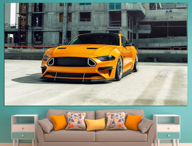 May include: A bright yellow sports car parked in an urban setting. The car has a black grille and black wheels. The car is parked in front of a concrete building.
