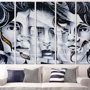 May include: A five-piece abstract art print set featuring a black and white portrait of a person with gold accents. The portrait is split into five sections, each showing a different part of the face.