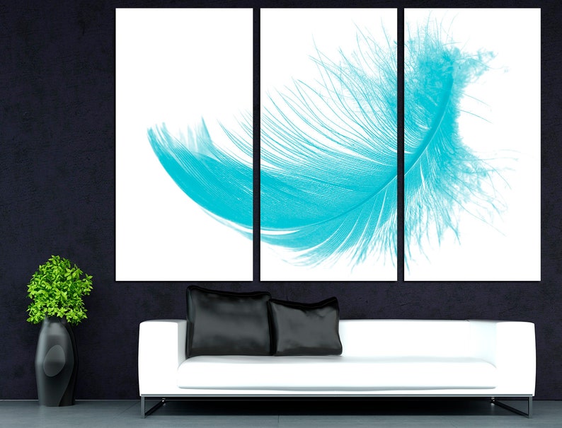 May include: A three-piece canvas print set featuring a single turquoise feather on a white background.
