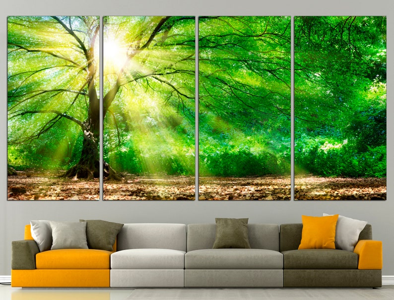 May include: A four-panel canvas print depicting a lush green forest scene with sunlight streaming through the trees. The print features a large tree in the centre, with its branches reaching out towards the sun.