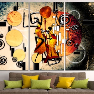May include: A three-panel abstract art print featuring stylised figures in yellow and orange against a background of black, white and grey geometric shapes and swirls.
