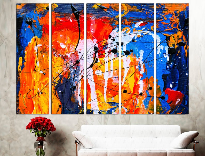 May include: Abstract art painting with a multi-panel design. The painting features bold strokes of blue, red, orange, yellow, and white paint. The painting is a modern and contemporary style.