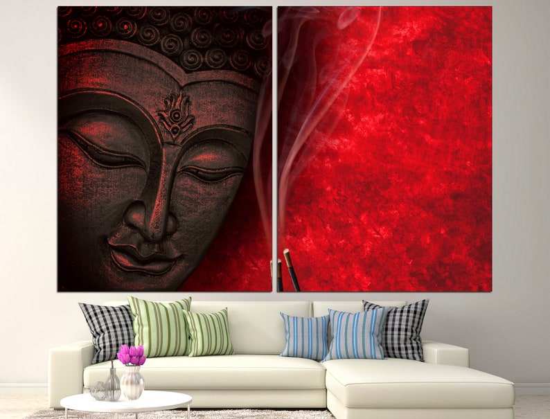 May include: A black and white Buddha statue with a red background and smoke rising from incense sticks.