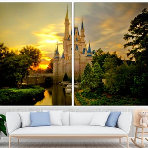 May include: A fairytale castle with a golden sunset in the background. The castle is surrounded by lush green trees and a calm body of water.