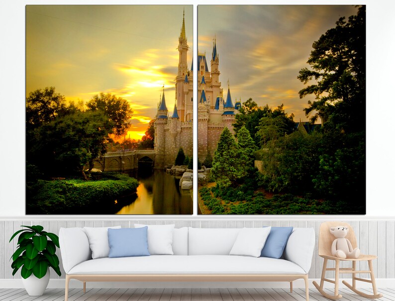 May include: A fairytale castle with a golden sunset in the background. The castle is surrounded by lush green trees and a calm body of water.