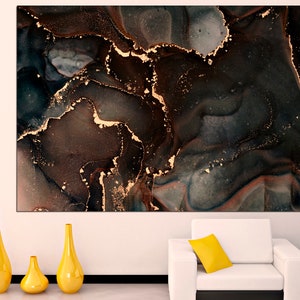 May include: Abstract art print with swirling black, brown, and gold colors. The print features a marbled effect with gold accents.