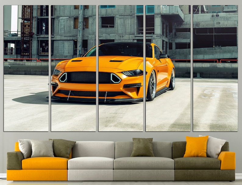 May include: A bright yellow sports car parked in a concrete car park. The car has a black grille and black wheels. The car is in focus, while the background is blurred.