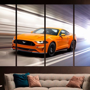 May include: A bright orange Ford Mustang sports car speeding through a tunnel with white lines on the road.