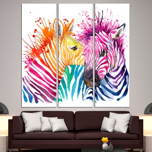 May include: Three colorful zebras with watercolor paint splatter in a modern art style. The zebras are painted in shades of pink, blue, green, yellow, and orange.