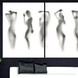 May include: A black and white abstract art print featuring five silhouettes of people in various poses. The silhouettes are blurred and appear to be behind a translucent surface.