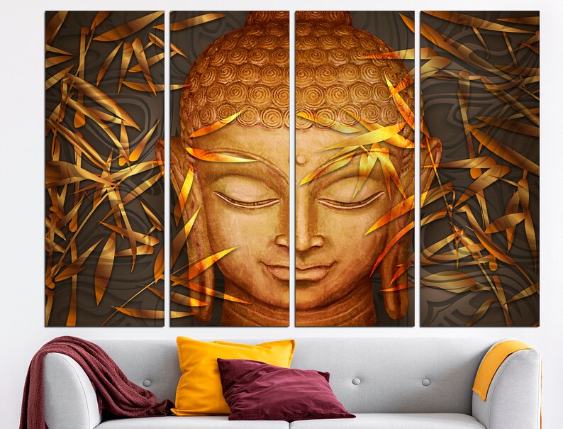 May include: A multi-panel canvas print featuring a golden Buddha head with closed eyes, surrounded by stylized golden bamboo leaves on a dark brown background.