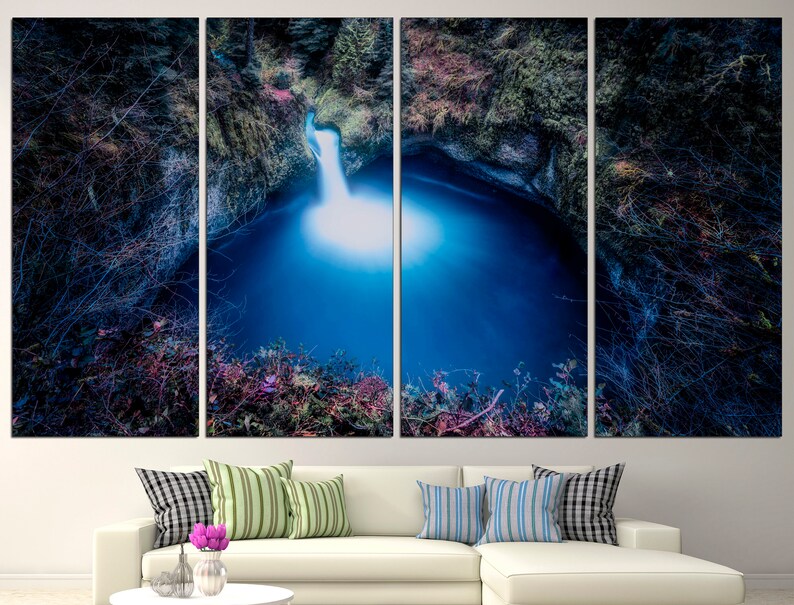 May include: A four-panel canvas print of a waterfall cascading into a deep blue pool surrounded by lush green foliage.