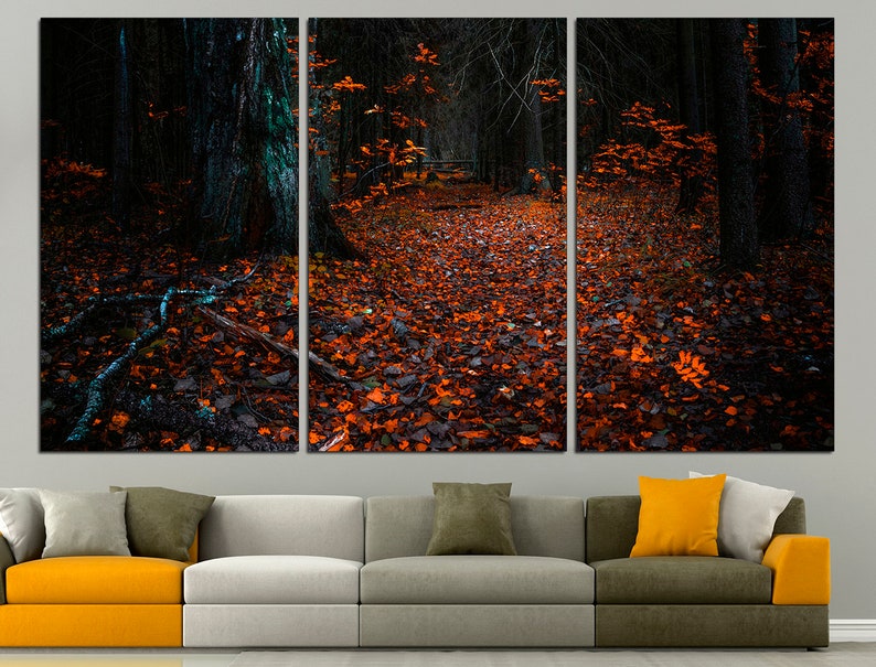 May include: A triptych canvas print of a dark forest path covered in fallen orange leaves. The path leads into the distance, with tall trees lining the sides.