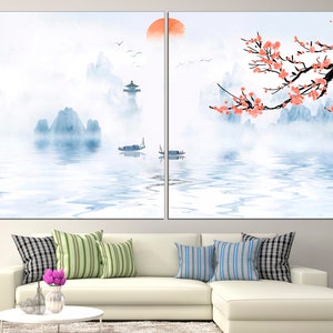 May include: A watercolor painting of a misty mountain landscape with a red sun in the sky. The mountains are reflected in the water, and there are pink blossoms on a tree branch in the foreground.