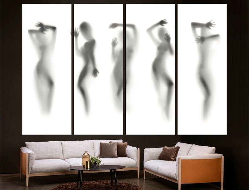 May include: A set of five black and white abstract art prints featuring silhouettes of people in various poses. The prints are framed and displayed on a white wall.