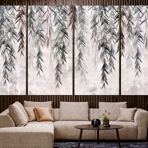 May include: A modern living room with a sectional sofa and a coffee table. The wall behind the sofa features a large-scale print of a watercolour painting of willow branches hanging down.