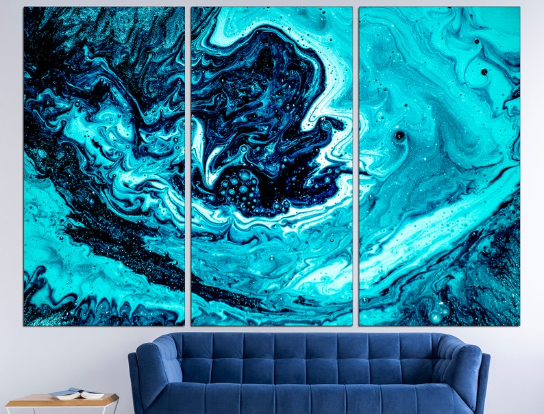 May include: Abstract art print featuring a swirling blue and black pattern. The print is divided into three panels, creating a dynamic and modern look.
