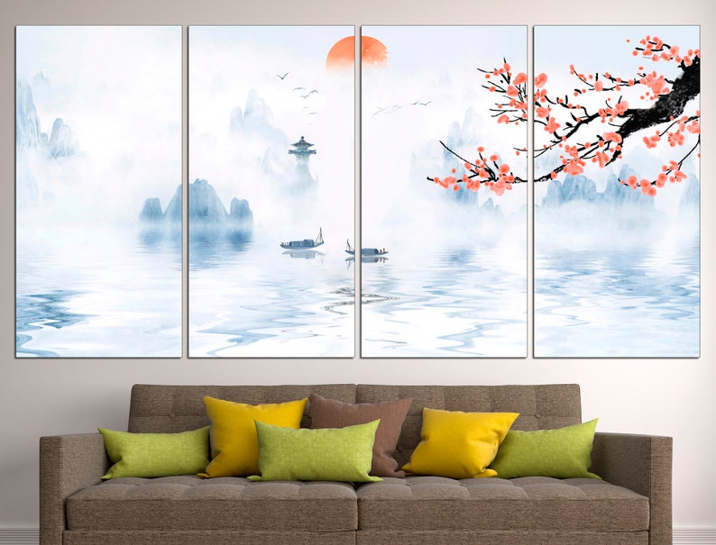 May include: A four-panel canvas print depicting a serene landscape with mountains, a lake, and a blooming cherry blossom tree. The sky is a soft blue with a hint of orange, suggesting a sunrise or sunset. The water is calm and reflective, with a few boats floating on its surface. The mountains are misty and ethereal, creating a sense of peace and tranquility.