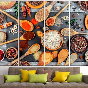 May include: A close-up of a variety of spices and grains arranged on a black slate surface. The spices include red pepper flakes, cumin, coriander, and black peppercorns. The grains include rice, quinoa, and couscous. The image is a still life of various spices and grains.